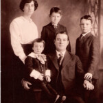 John Alexander Poythress, Sr. family portrait taken about 1915. John Alexander is the son of Charles David (pictured as a young man in the previous family portrait) Left to right in the background: Effie Eason Poythress, Willis Eason Poythress, John Alexander Poythress, Jr. Foreground is Cecil Adams Poythress and John Alexander Poythress, Sr.
