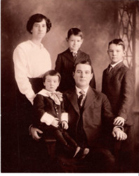 John Alexander Poythress, Sr. family portrait taken about 1915. John Alexander is the son of Charles David (pictured as a young man in the previous family portrait) Left to right in the background: Effie Eason Poythress, Willis Eason Poythress, John Alexander Poythress, Jr. Foreground is Cecil Adams Poythress and John Alexander Poythress, Sr.