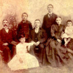 Charles David Poythress Family Picture. Left to right: father Charles David Poythress, Charles Vance Poythress, James Sneed Poythress, John Alexander Poythress, mother Indiana Peru (nee Twisdale) Poythress, Benjamin Edison Poythress (toddler), and in front seated is Effie Poythress.