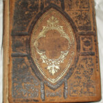 Bible's Cover: The cover is tooled leather with gold embossing and measures 10 inches by 12 inches, is three inches thick and weighs 8.5 pounds.